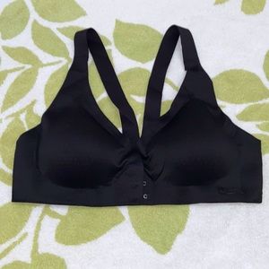 It’s a black bra that connects in the front to give more support. Size XL